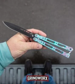Bear Ops Bear Song IV Cyan Speckle Blue Butterfly Knife - Black -Best Knife Shop Bear Ops Bear Song IV Butterfly Knife Cyan Speckle Blue Black BHQ 83465 kp in hand web large